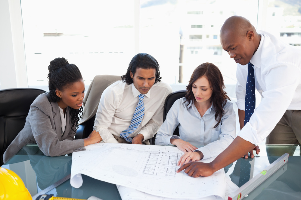 Business team seriously working with flipchart sheets