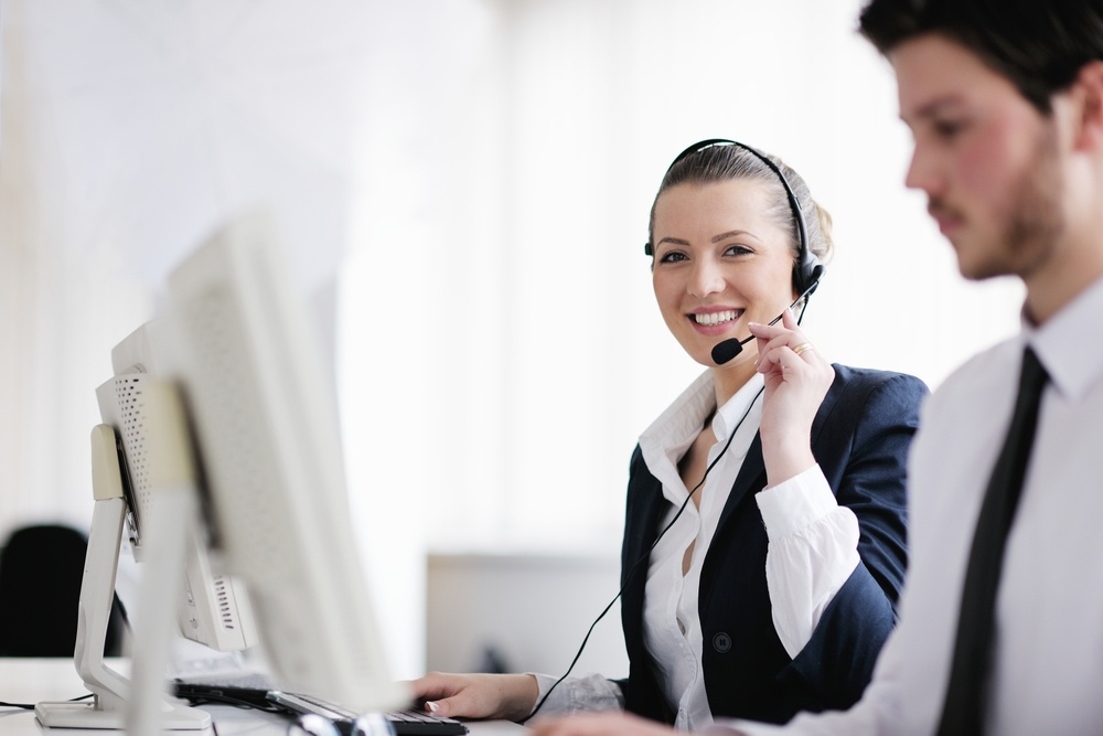 business people group with  headphones giving support in  help desk office to customers, manager giving training and education instructions